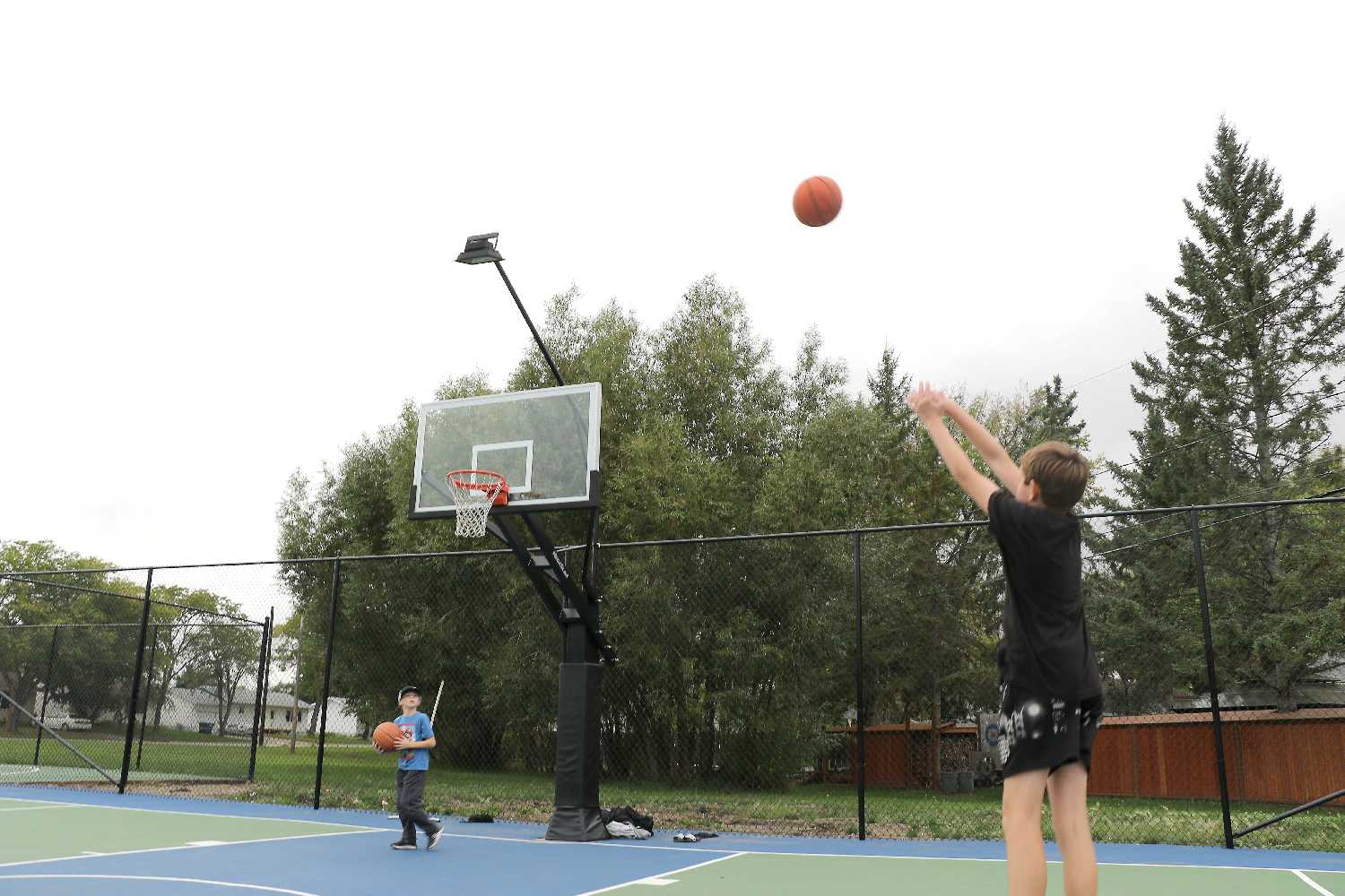 Kids shooting hoops at Terry Lynd Court last week.